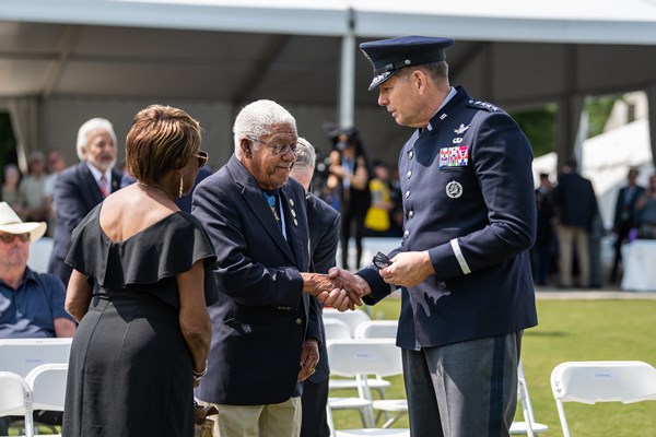 Medal_of_Honor_recipient_Melvin_Morris_alongside_his_wife_talks_with_Vice_Chief_of_Space_Operations_U.S._Space_Force_Gen._David_D._Thompson